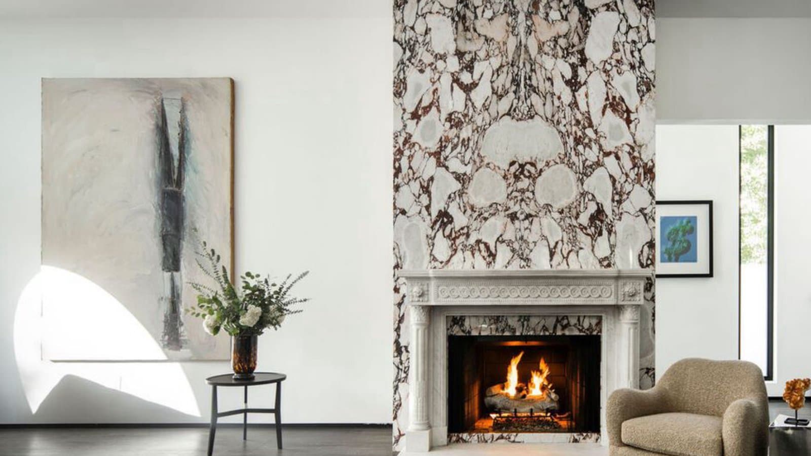 Living room with a marble fireplace surround, an example of listing photography