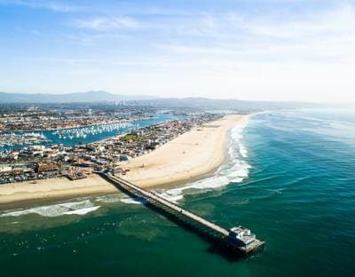 Aerial view of Newport Beach showing the peninsula, pier and harbor entrance